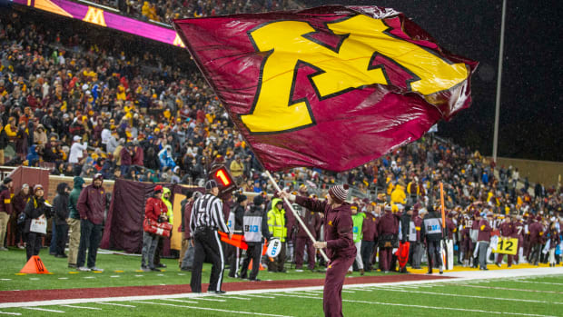 Oct 12, 2019; Minneapolis, MN, USA; Minnesota Golden Gophers cheerleaders waves a flag after a touchdown against the Nebraska Cornhuskers at TCF Bank Stadium. Mandatory Credit: Jesse Johnson-USA TODAY Sports